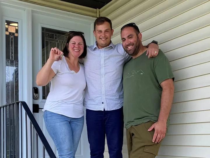 Joe C. with Cameron on the front step, keys in hand